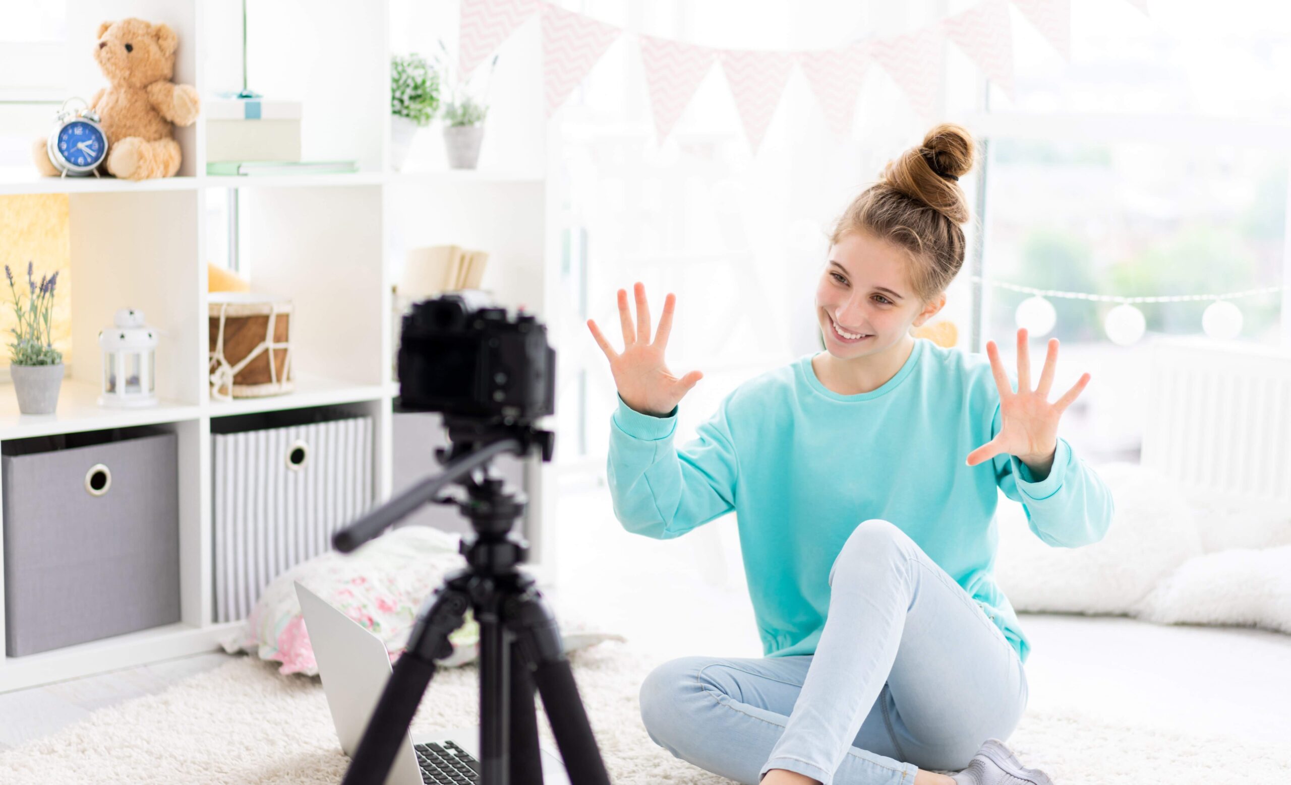 Social media content creator filming in front of a camera for her audience